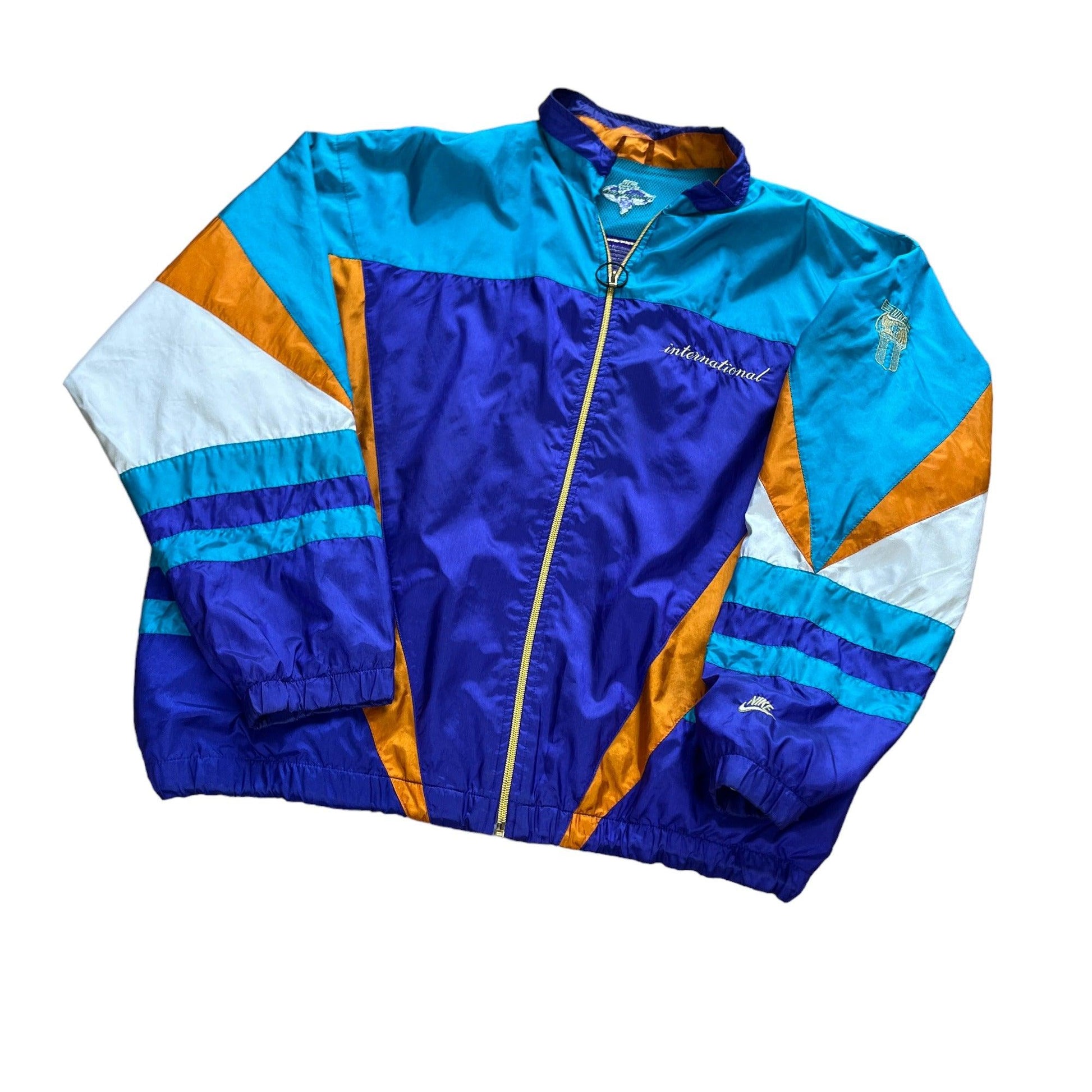 Vintage 90s Blue/ Green, Purple, White + Orange Nike International Windbreaker Jacket - Extra Large - The Streetwear Studio